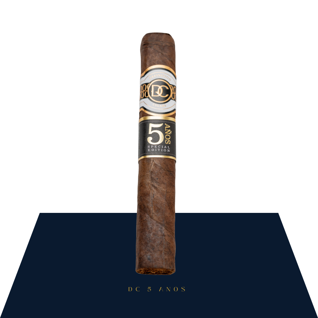 Definition Cigars 5 Años, 5.75x54, medium-dark brown wrapper, elegant cream and gold band.